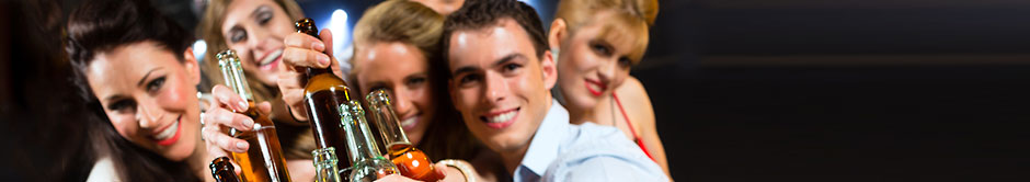 Young folks raising beer bottles